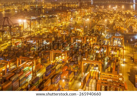 HONG KONG -Nov14: Containers at Hong Kong commercial port on Nov 14, 2014 in Hong Kong, China. Hong Kong is one of several hub ports serving more than 240 million tonnes of cargo during the year.