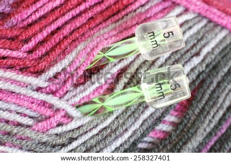 Woolen thread and knitting needle. Needlework accessories isolated on white background.
