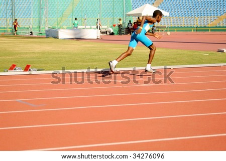 PORT OF SPAIN - JULY 26: Jevon Joseph sprints during the 35th Hampton International Games July 26, 2009 in Port of Spain, Trinidad & Tobago.