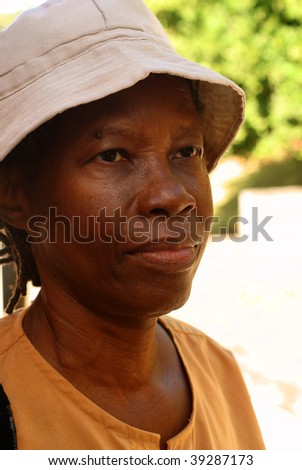 elderly woman with had looking with a blank face