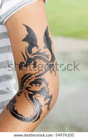stock photo : dragon tattoo on female arm