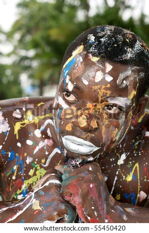 portrait of man with multicolored body paint on skin