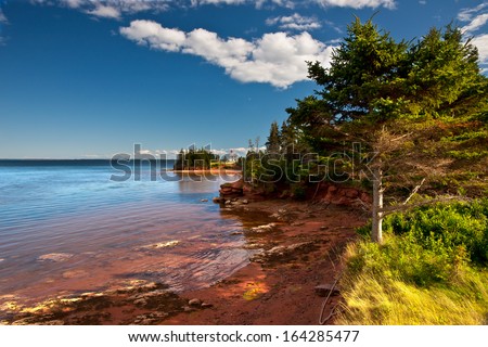 Prince Edward Island Lighthouse across red water bay