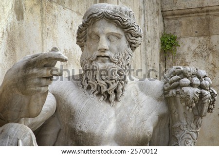 close up statue of old father tiber holding a horn of plenty rome italy