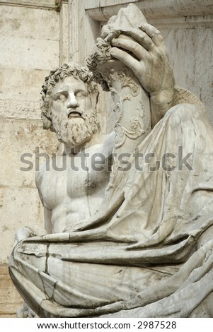 close up statue of old father tiber holding a cornucopia in the capitol rome italy
