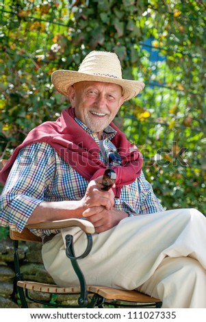 Portrait of senior man outdoors with sunglasses