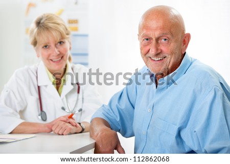Happy senior patient and doctor at the doctor\'s office