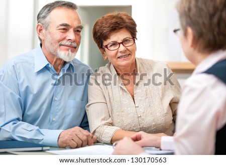 Senior couple discussing financial plan with consultant