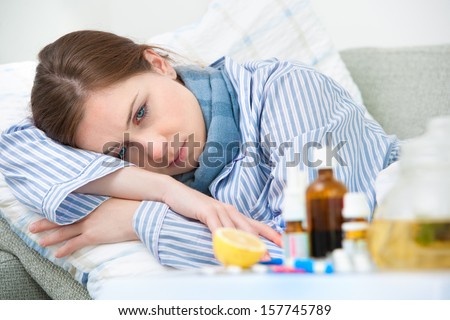 Sick woman  lying in bed with high fever. Cold, flu, fever and migraine