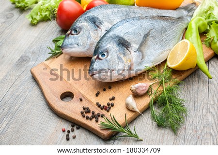 Fresh raw fish gilt head bream  a cutting board