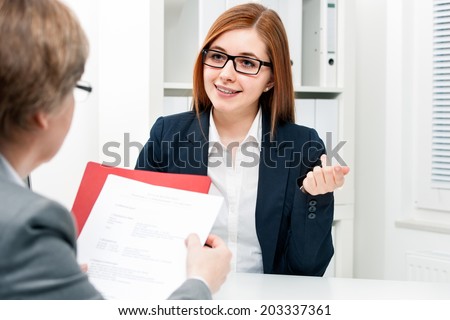 Young woman discussing during a job interview at office