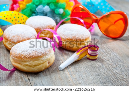 Krapfen or donuts with jam and icing sugar
