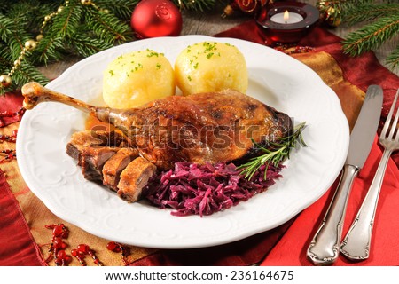 Crusty goose leg with braised red cabbage and dumplings