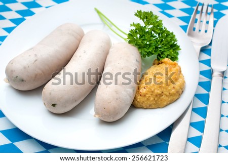 Bavarian meal. White sausages with sweet mustard on a plate