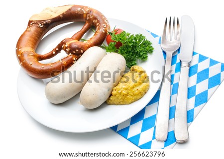 Bavarian meal. White sausages with sweet mustard and pretzels