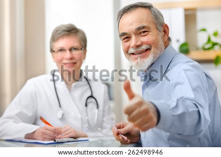 Happy senior patient and doctor at the doctor\'s office