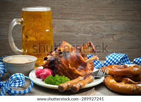 Roasted pork knuckle with pretzels and beer. Oktoberfest