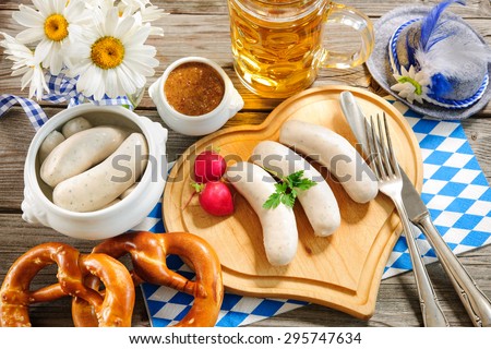 Traditional Bavarian meal. White sausage with sweet mustard and pretzel