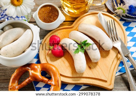 Traditional Bavarian meal. White sausage with sweet mustard and pretzel