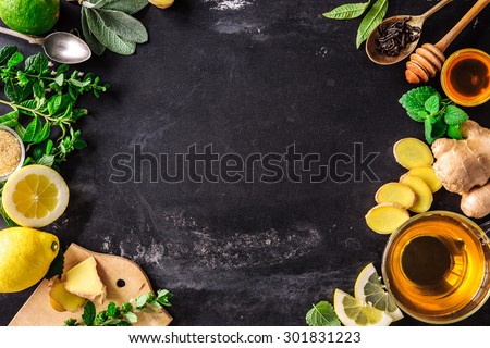 Ingredients for ginger tea with lemon and honey on slate plate