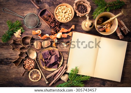 Baking concept background with cookbook, spices and utensils for Christmas cookies