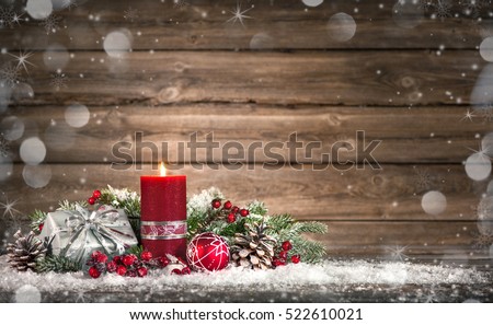Advent decoration with one burning candle on wooden board. Christmas background