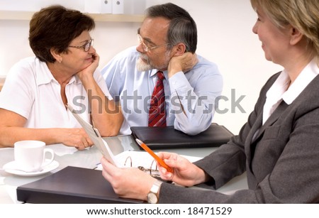 Mature couple by financial planner