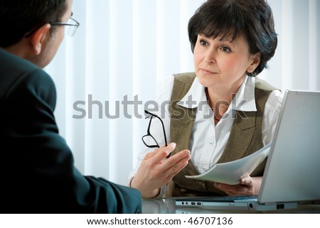 mid-adult businessman in a conversation with the consultant or psychologist