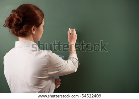 girl writing on a chalkboard