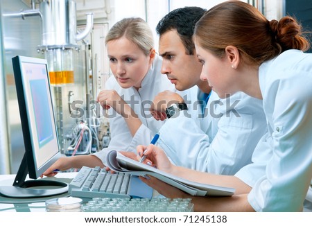 group of scientists working at the laboratory