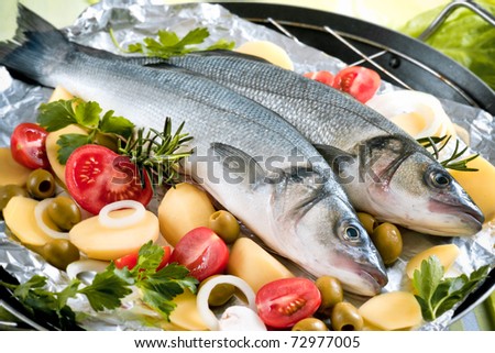 Sea-bass with the vegetables on a grill