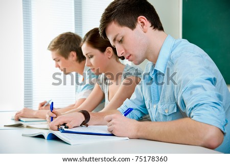 young students studying together in a classroom