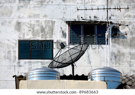 Antenna and small satellite on the top of the building.