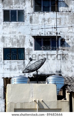 Antenna and small satellite on the top of the building.