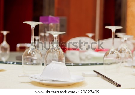 Fine restaurant dinner table place setting: napkin & wineglass