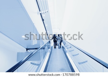 Blue Moving Escalator In The Office Hall Perspective View