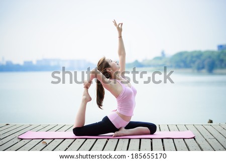 woman practicing yoga at seashore woman practicing yoga at seashore