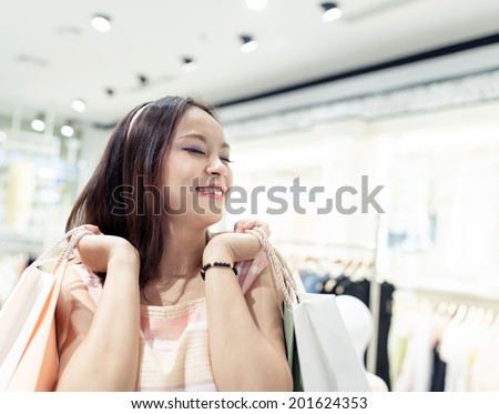 Beautiful young women shopping in a clothing store