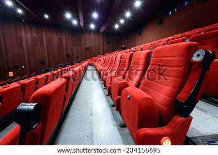 Empty movie theater with red seats