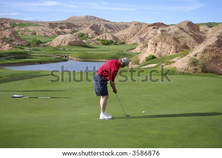 Man putting on beautiful golf course (Wolf Creek Golf Course in Mesquite, Nevada)