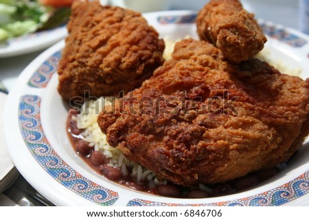 fried chicken and rice and beans