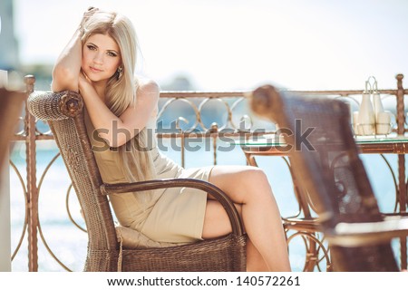 beautiful woman in restaurant cafe with tiramisu cake and coffee.Healthy food drink for breakfast.Stylish rich slim girl in retro dress.glamorous lady at vacation. Retro style.France.series