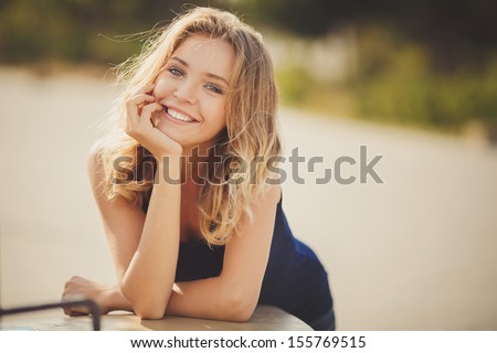Young Smiling Woman Outdoors Portrait. Soft Sunny Colors.Close Portrait.