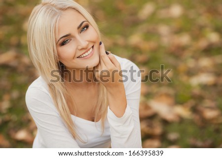 Close Up Portrait Of Young Blonde Beautiful Woman In Warm Autumn Scarf. Ourdoors.