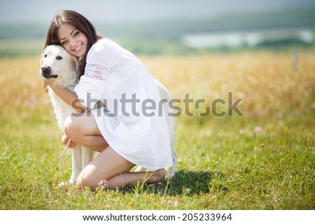 Beautiful woman playing with her ??dog. Outdoor portrait. series. young woman with dog outdoor day portrait