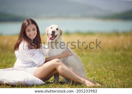Beautiful woman playing with her ??dog. Outdoor portrait. series. young woman with dog outdoor day portrait