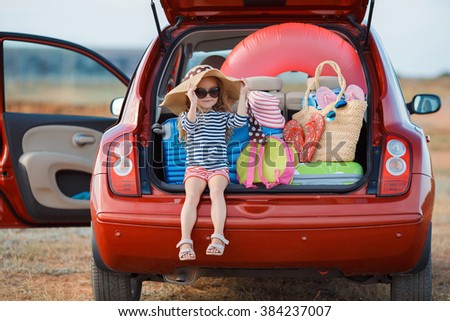 Vacation, Travel - family ready for the travel for summer vacation. suitcases and car with sea on background. girl with map in hands planning road trip. travel concept. traveler.