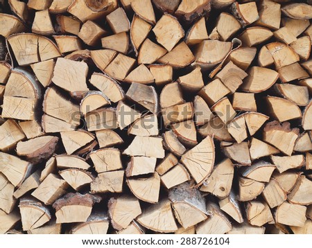 Pile of logs or stack of firewood as a symbol of Russian village, country life style and retro custom to stoke of stove in wooden house
