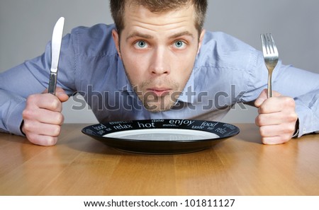 stock-photo-hungry-man-waiting-to-be-served-101811127.jpg