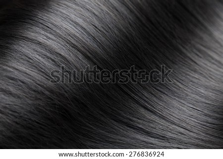 Closeup on luxurious straight and glossy black hair